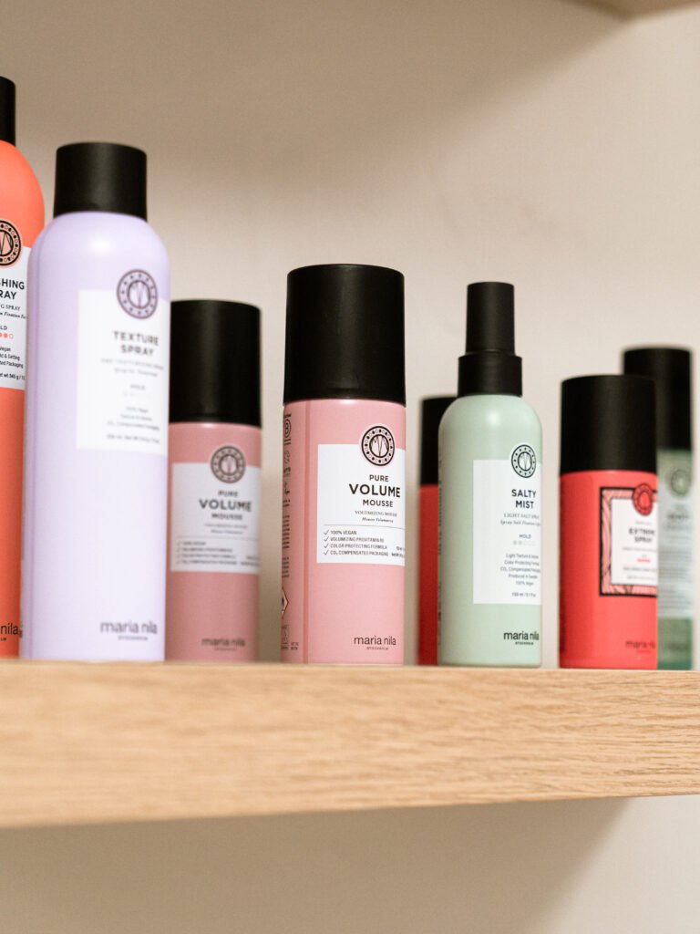 Professional hair products on the retail shelf at Salon Linen, The Woodlands, TX